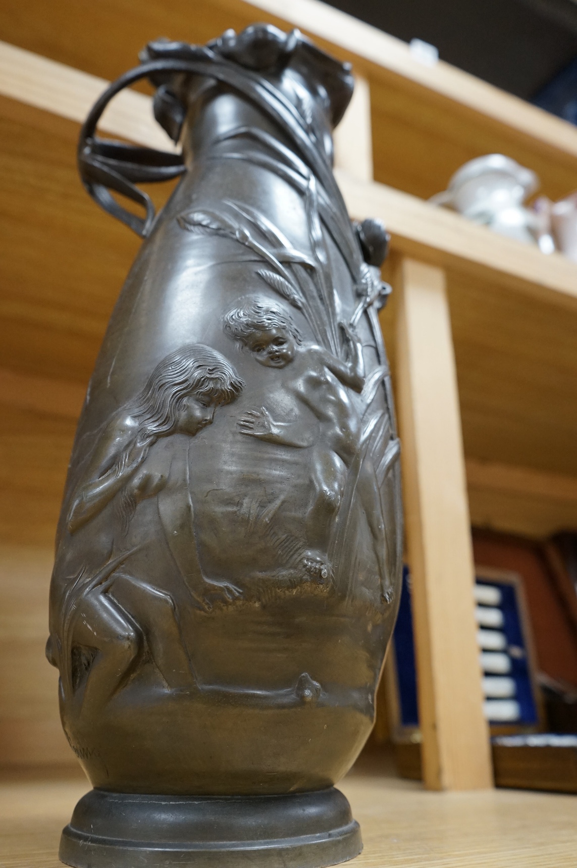An Art Nouveau large pewter ewer, singed W. Herring, 47cm tall. Condition - poor